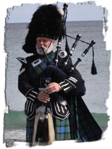 Bagpiper photo of bag piper playing pipes